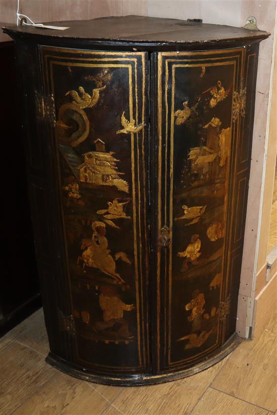 A George III chinoiserie lacquered bowfront hanging corner cabinet H.91cm